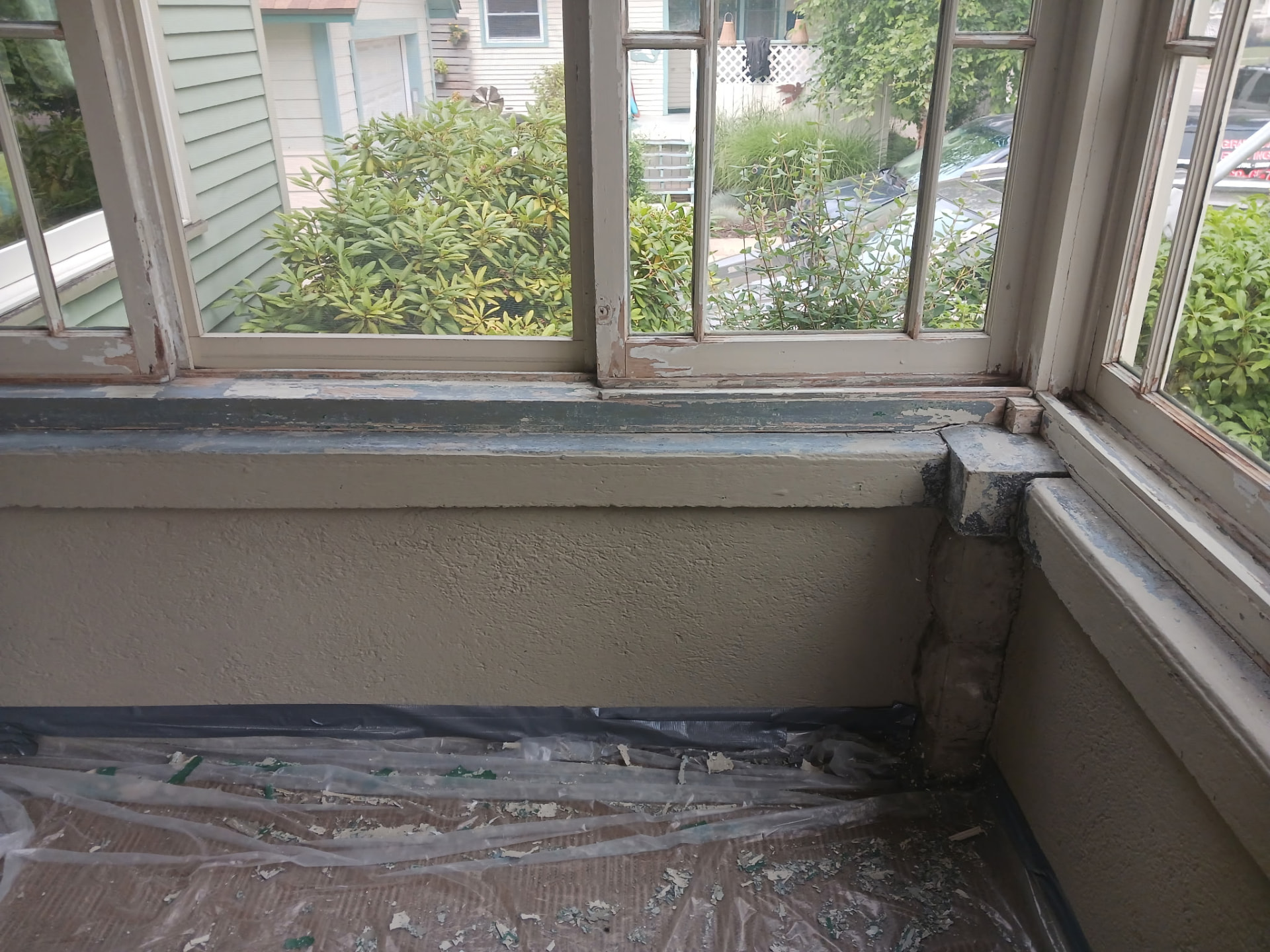 Before — Peeling window sills and trim