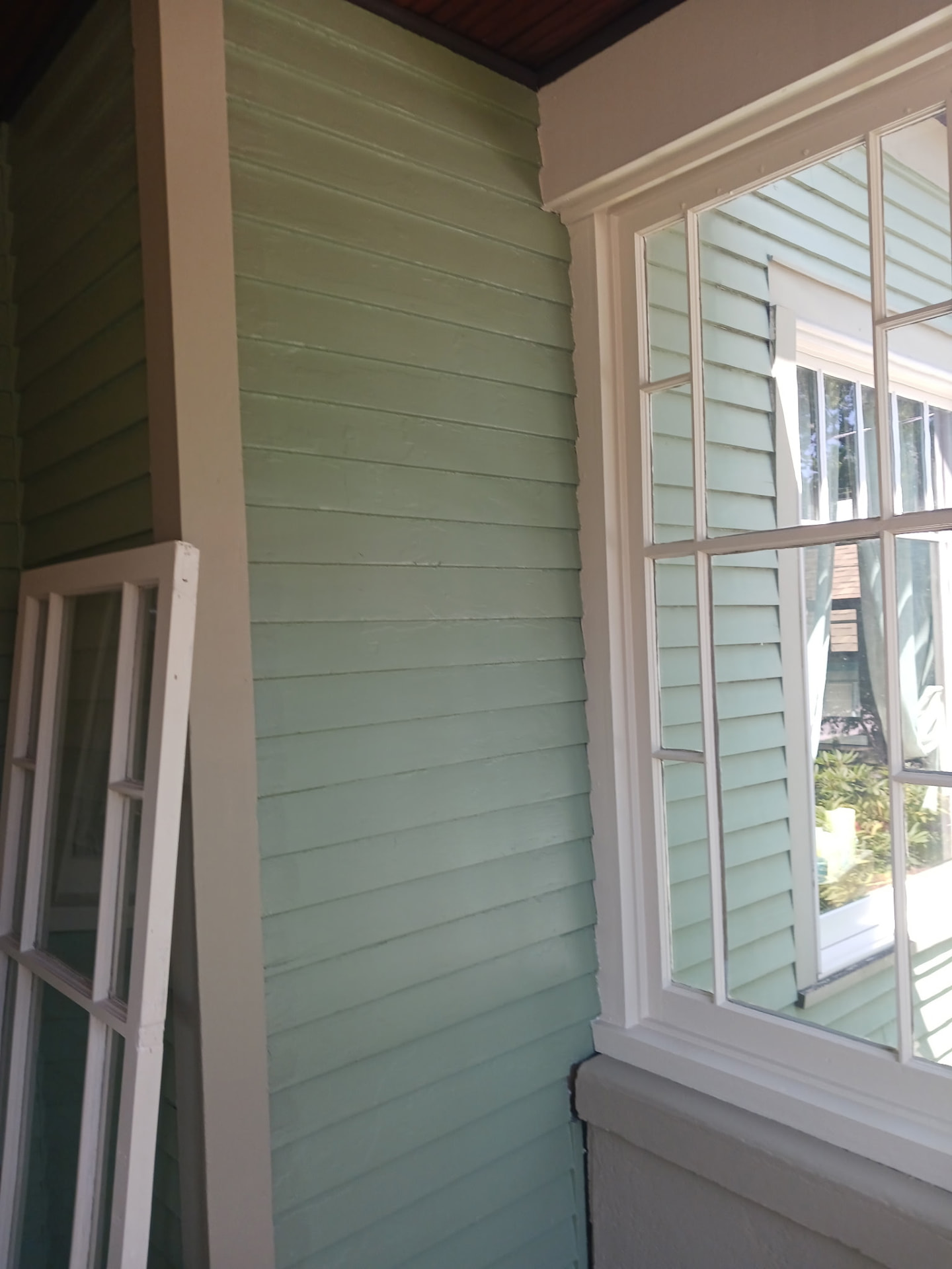 After — Freshly painted siding and trim