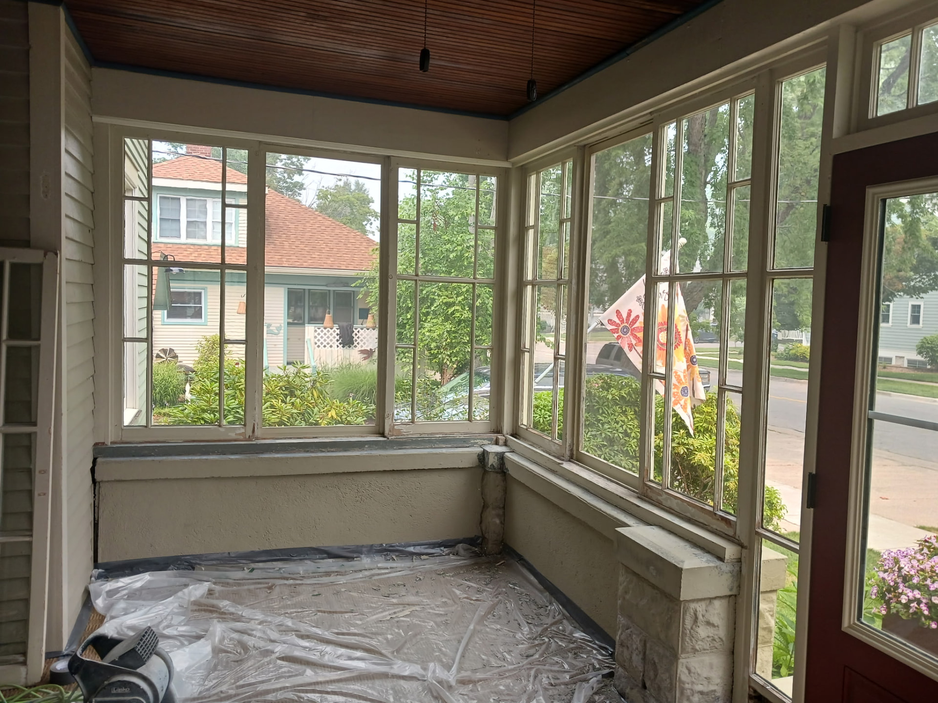 Before — Worn sunroom interior